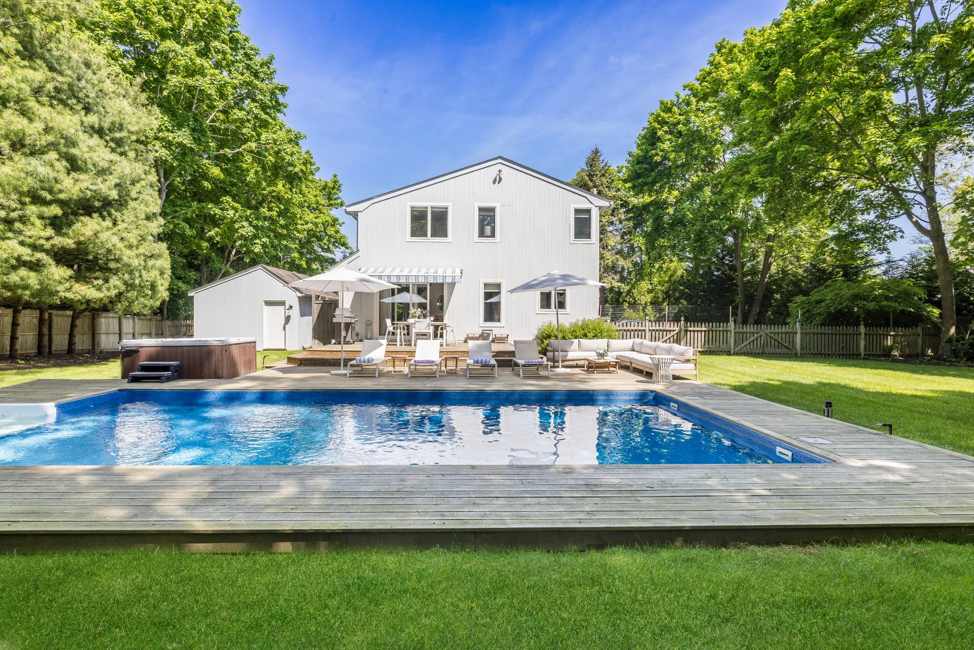 4594 Noyack Road Sag Harbor, NY 11963 - Photo 26 of 31 a view of a house with a yard