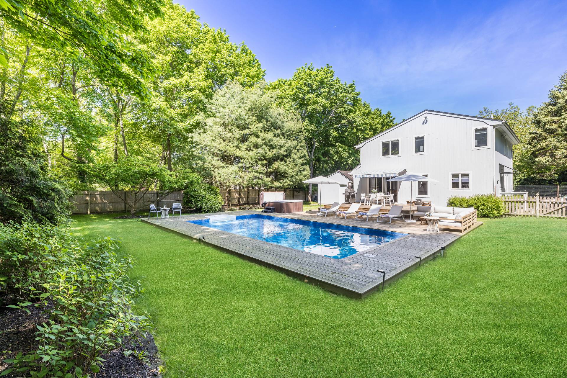 4594 Noyack Road Sag Harbor, NY 11963 - Photo 6 of 31 a view of a house with pool and a yard