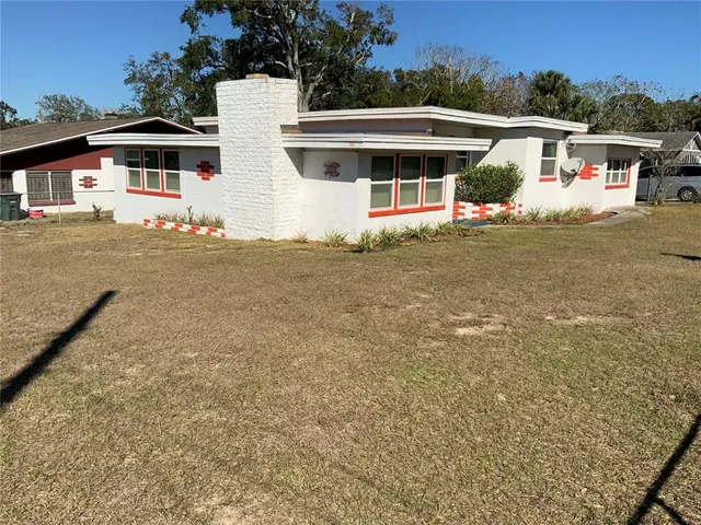 a view of front door and small yard
