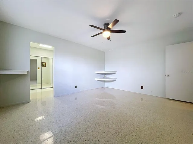 an aerial view of a house with a yard and lake view