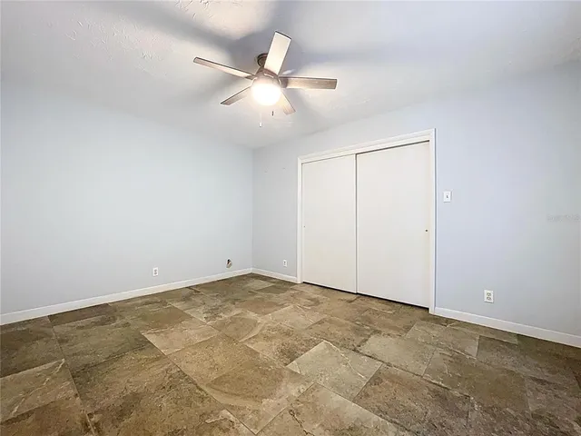 an aerial view of a houses with a yard