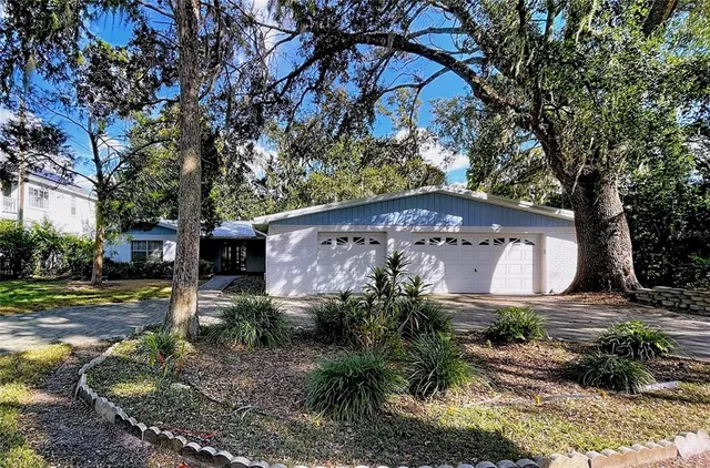 a front view of house with yard and green space