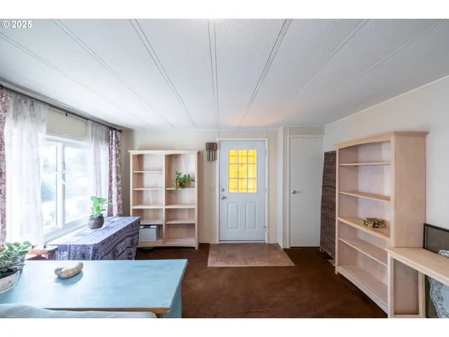 a living room with furniture window and wooden floor