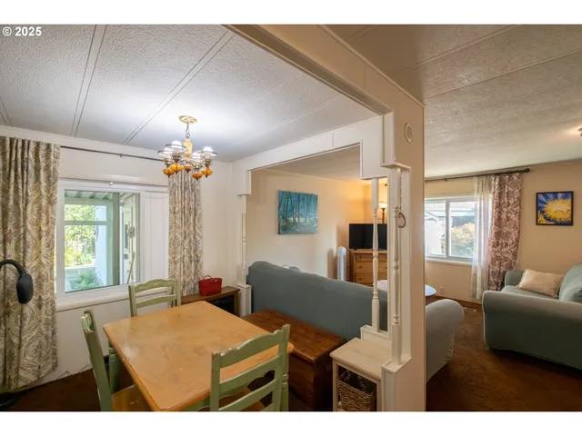 a view of a livingroom with furniture and a chandelier