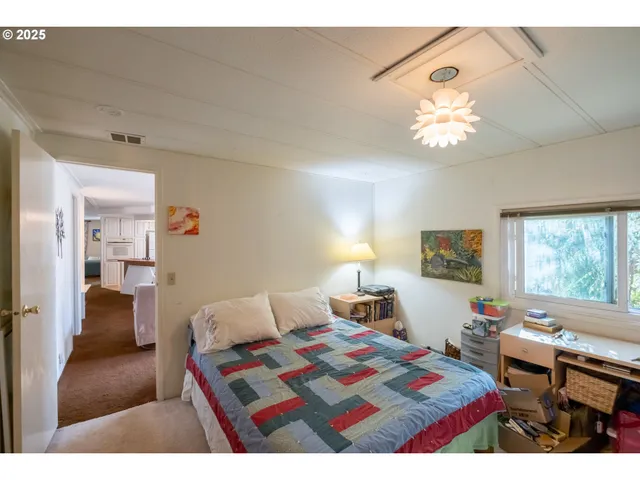 a living room with furniture and a lamp