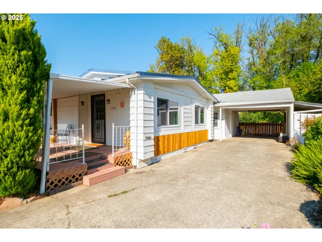 a view of house with outdoor space and porch