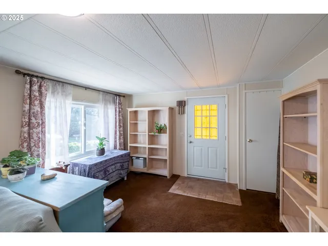 a living room with furniture and windows