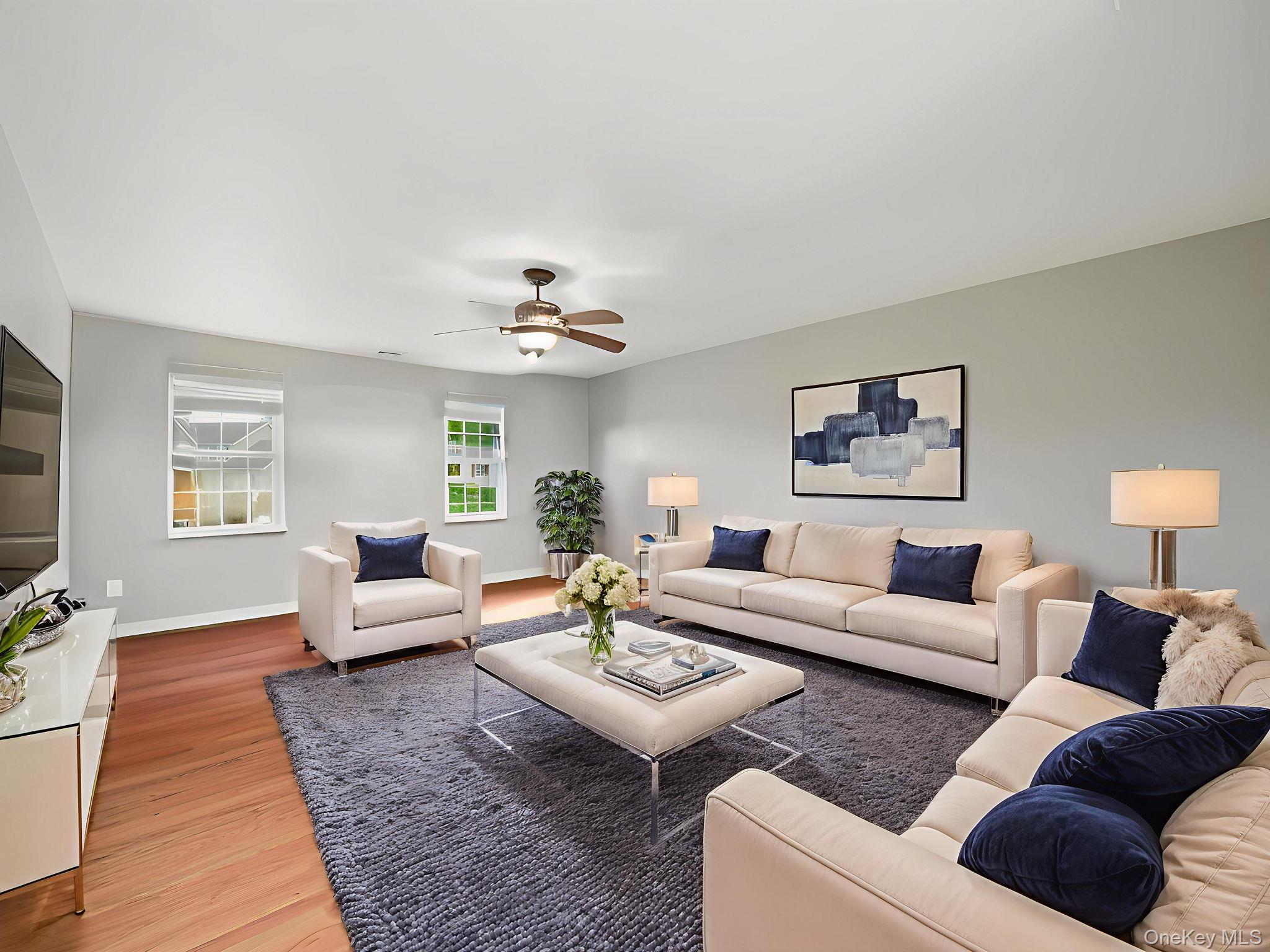 74 Red Maple Way New Windsor, NY 12553 - Photo 10 of 25 Living area featuring light wood finished floors and ceiling fan