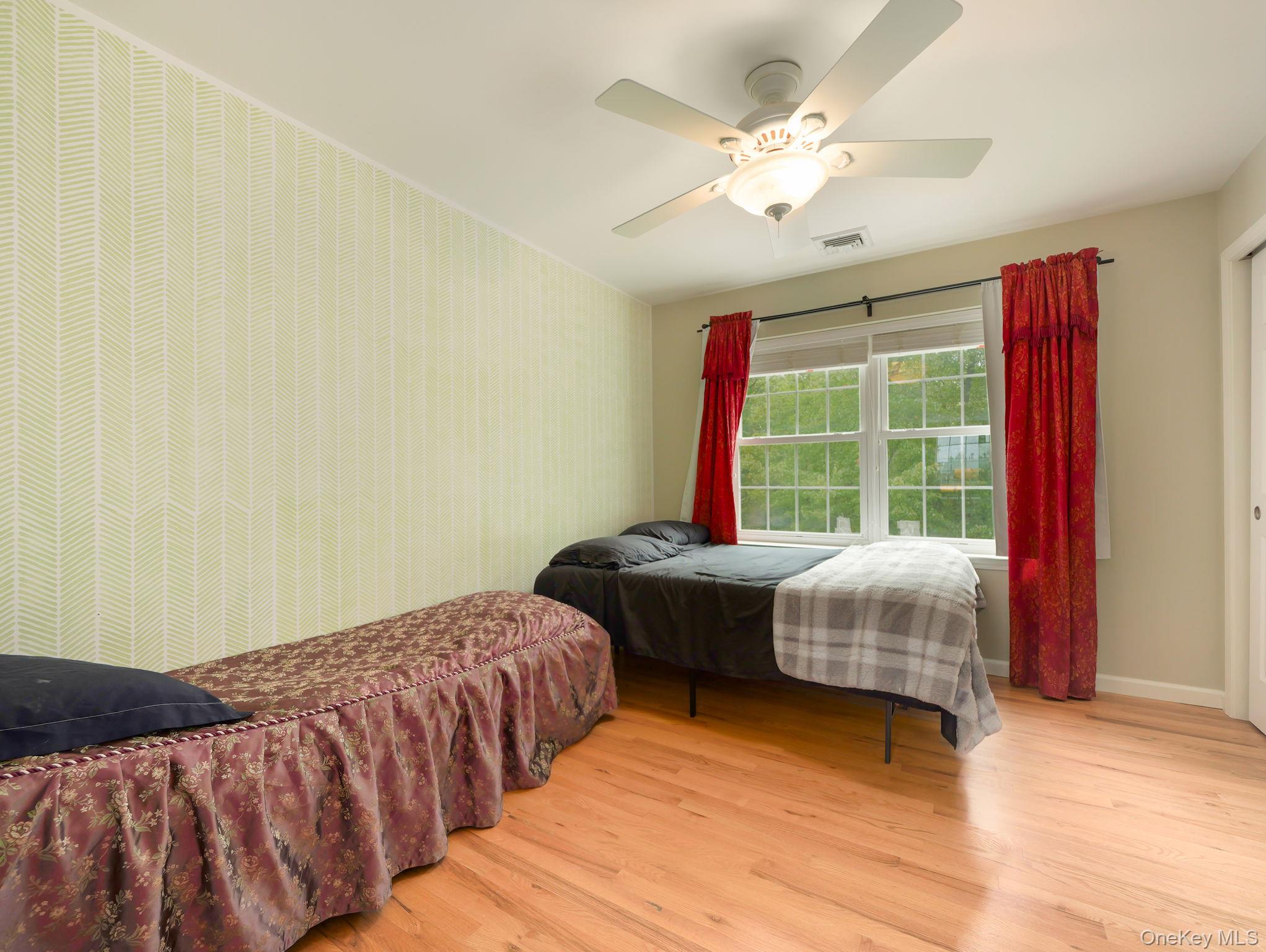 74 Red Maple Way New Windsor, NY 12553 - Photo 14 of 25 Bedroom with light wood-style flooring and ceiling fan