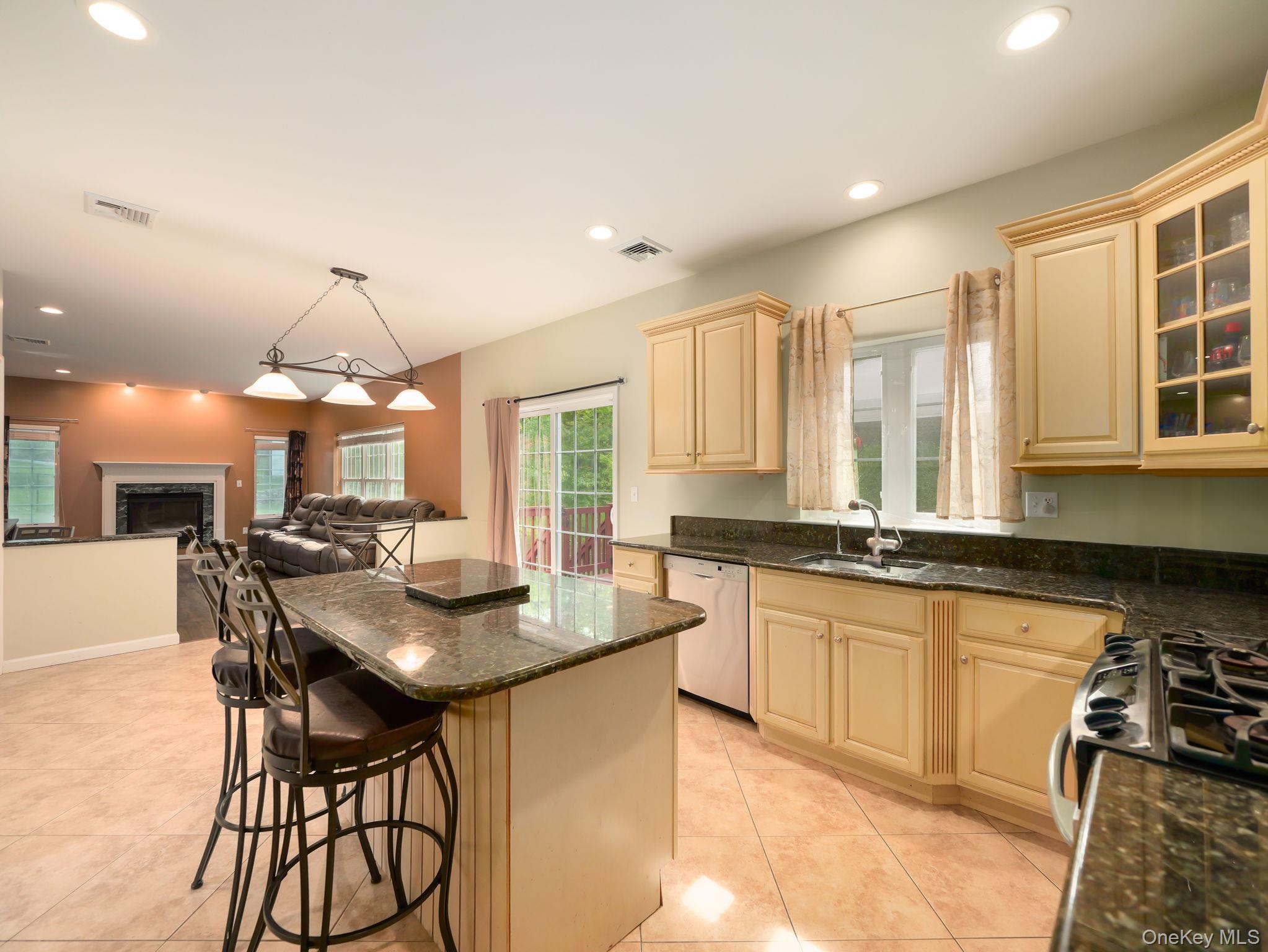 74 Red Maple Way New Windsor, NY 12553 - Photo 25 of 25 Kitchen with open floor plan, recessed lighting, hanging light fixtures, a center island, and light tile patterned floors