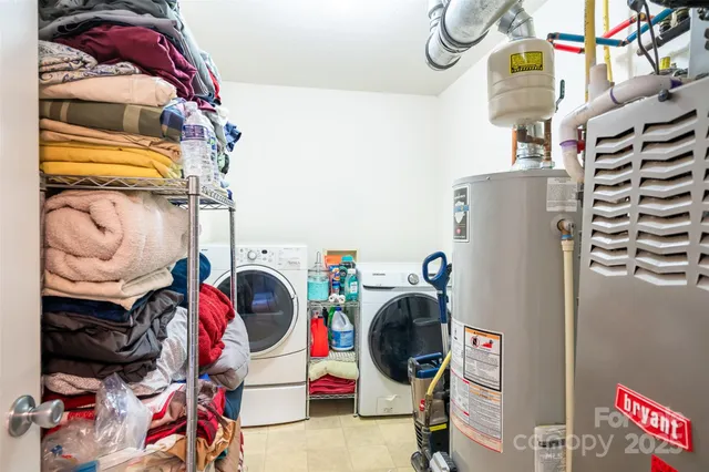 a bedroom with furniture and a chandelier