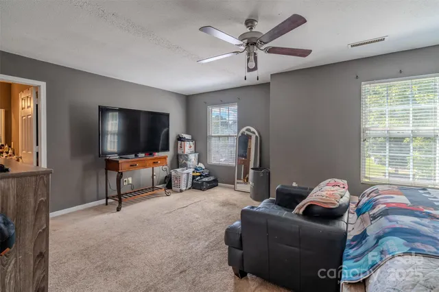 a bedroom with a bed and dresser