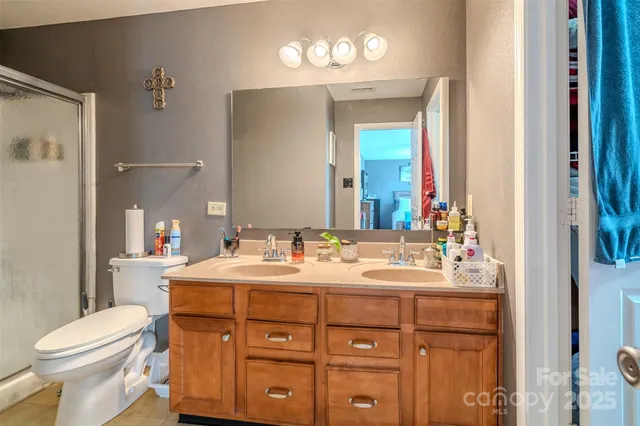 a view of a hallway with wooden shelves