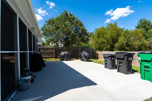 a front view of a house with a yard and a garden