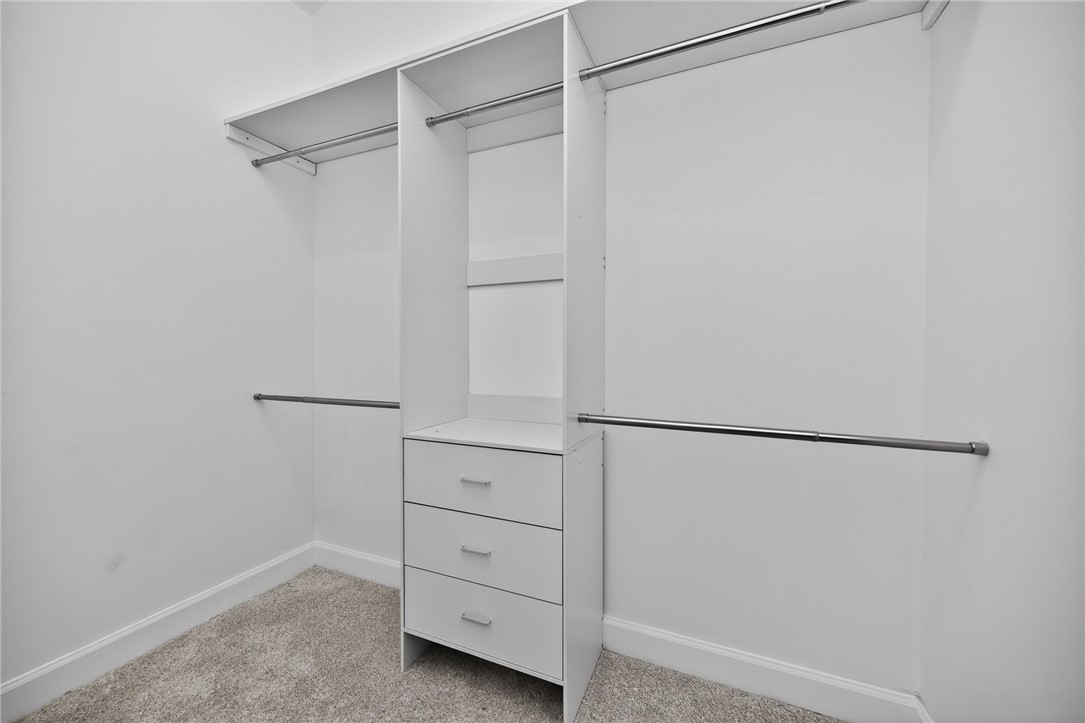 811 Wind Bluff Point Springboro, OH 45066 - Photo 21 of 51 This spacious walk-in closet offers exceptional organization with built-in shelving and ample hanging space.
