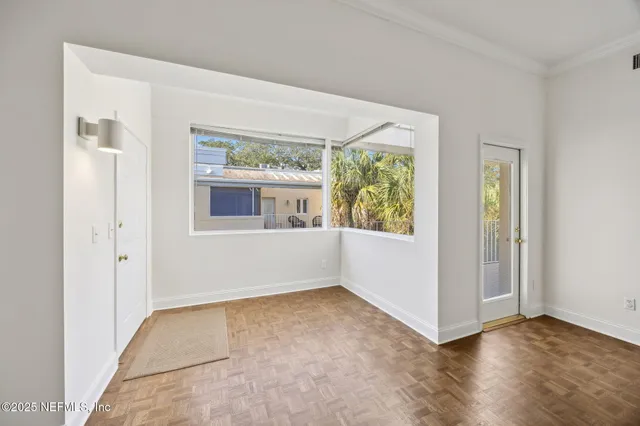 a view of hallway with wooden floor