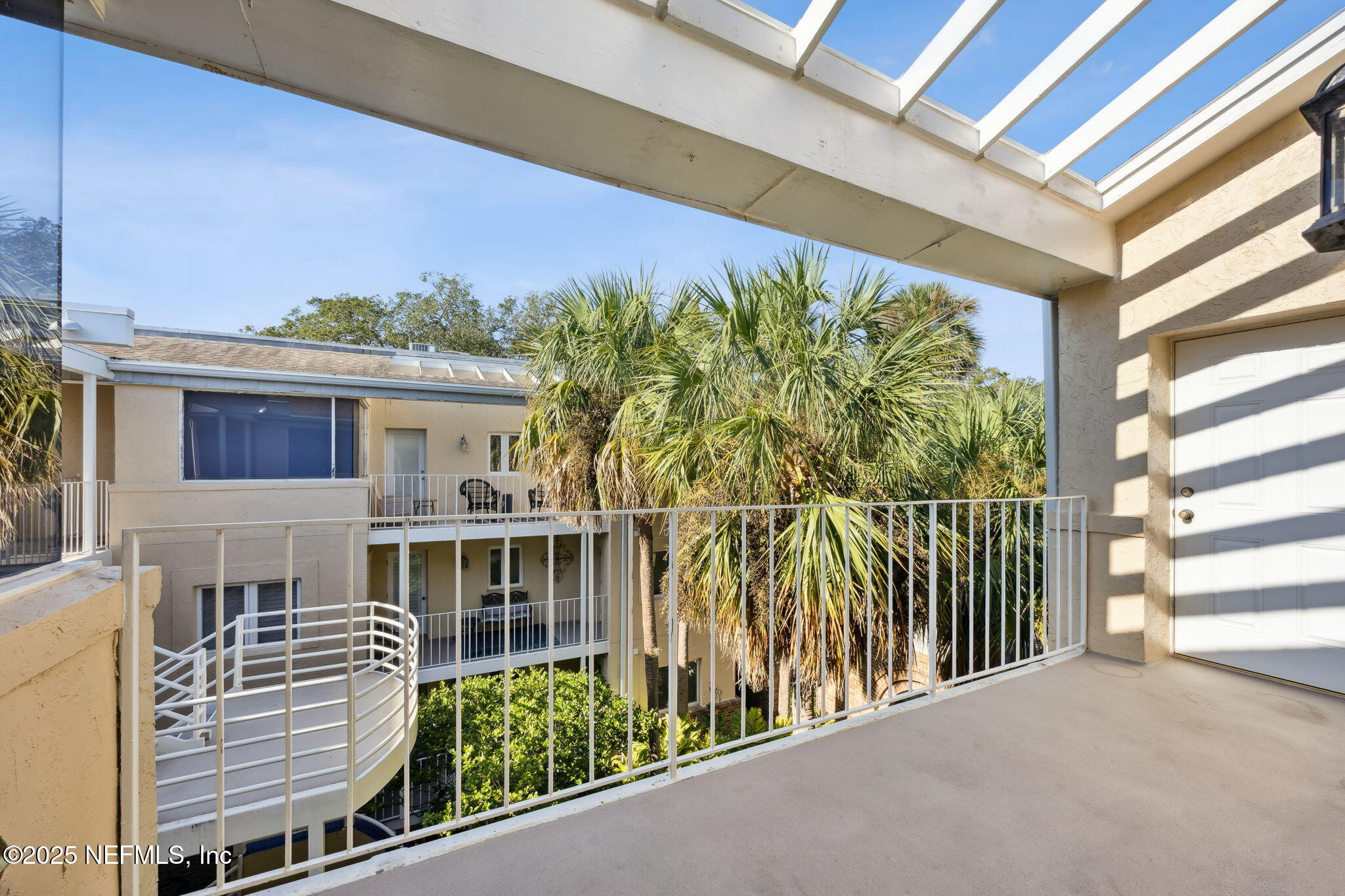 2912 St Johns Avenue, Unit 17 Jacksonville, FL 32205 - Photo 19 of 60 a view of a balcony with potted plants