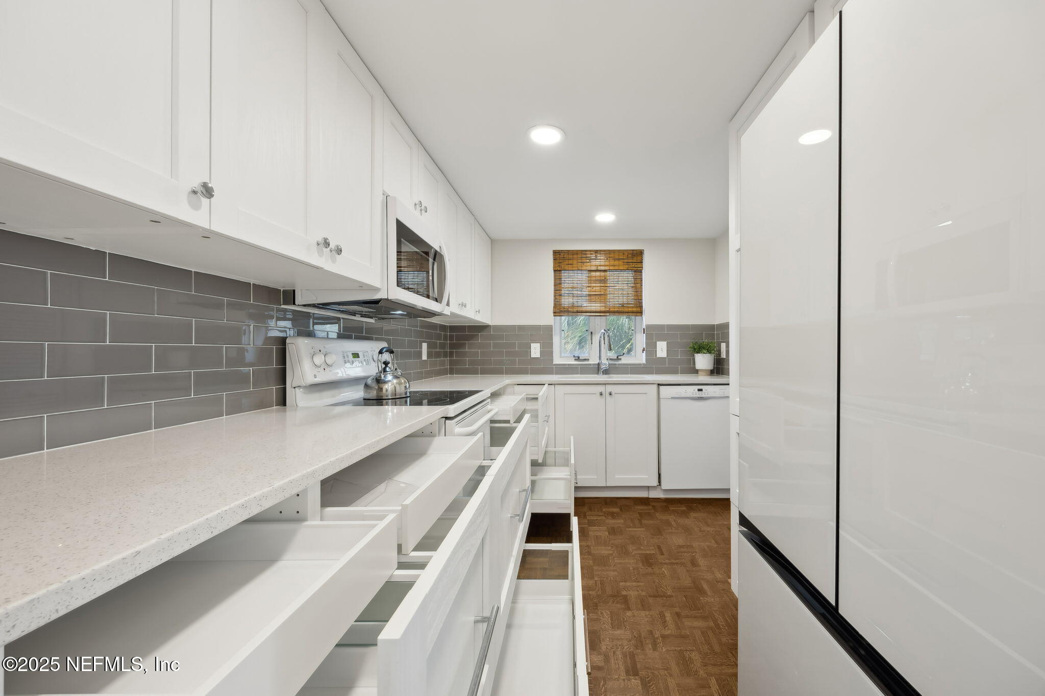 2912 St Johns Avenue, Unit 17 Jacksonville, FL 32205 - Photo 25 of 60 a kitchen with stainless steel appliances a refrigerator sink and cabinets