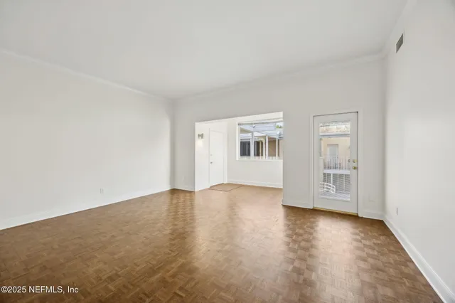 a view of a chair and table in the balcony