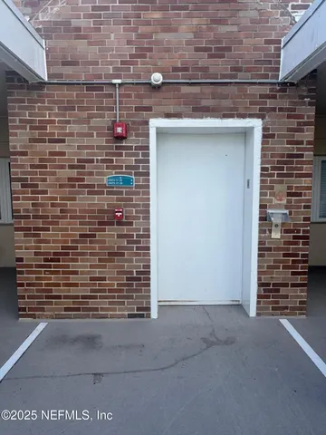 a view of a balcony with potted plants