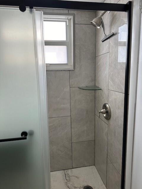 808 Southeast 7th Street, Unit 101B Deerfield Beach, FL 33441 - Photo 11 of 36 a bathroom with a glass door shower
