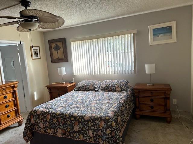 808 Southeast 7th Street, Unit 101B Deerfield Beach, FL 33441 - Photo 20 of 36 a bedroom with a bed and a chandelier