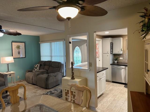 808 Southeast 7th Street, Unit 101B Deerfield Beach, FL 33441 - Photo 2 of 36 a living room with furniture kitchen and a chandelier