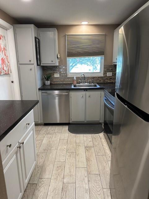 808 Southeast 7th Street, Unit 101B Deerfield Beach, FL 33441 - Photo 24 of 36 a kitchen with stainless steel appliances granite countertop a refrigerator a sink and white cabinets