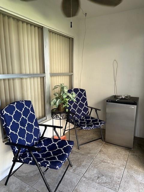 808 Southeast 7th Street, Unit 101B Deerfield Beach, FL 33441 - Photo 28 of 36 a living room with a couch and a table