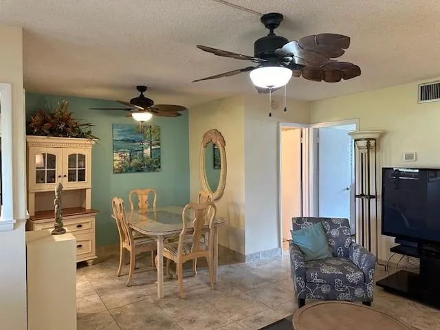 a view of a livingroom with furniture and a window