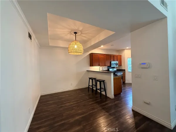 a view of kitchen and dining room with wooden floor