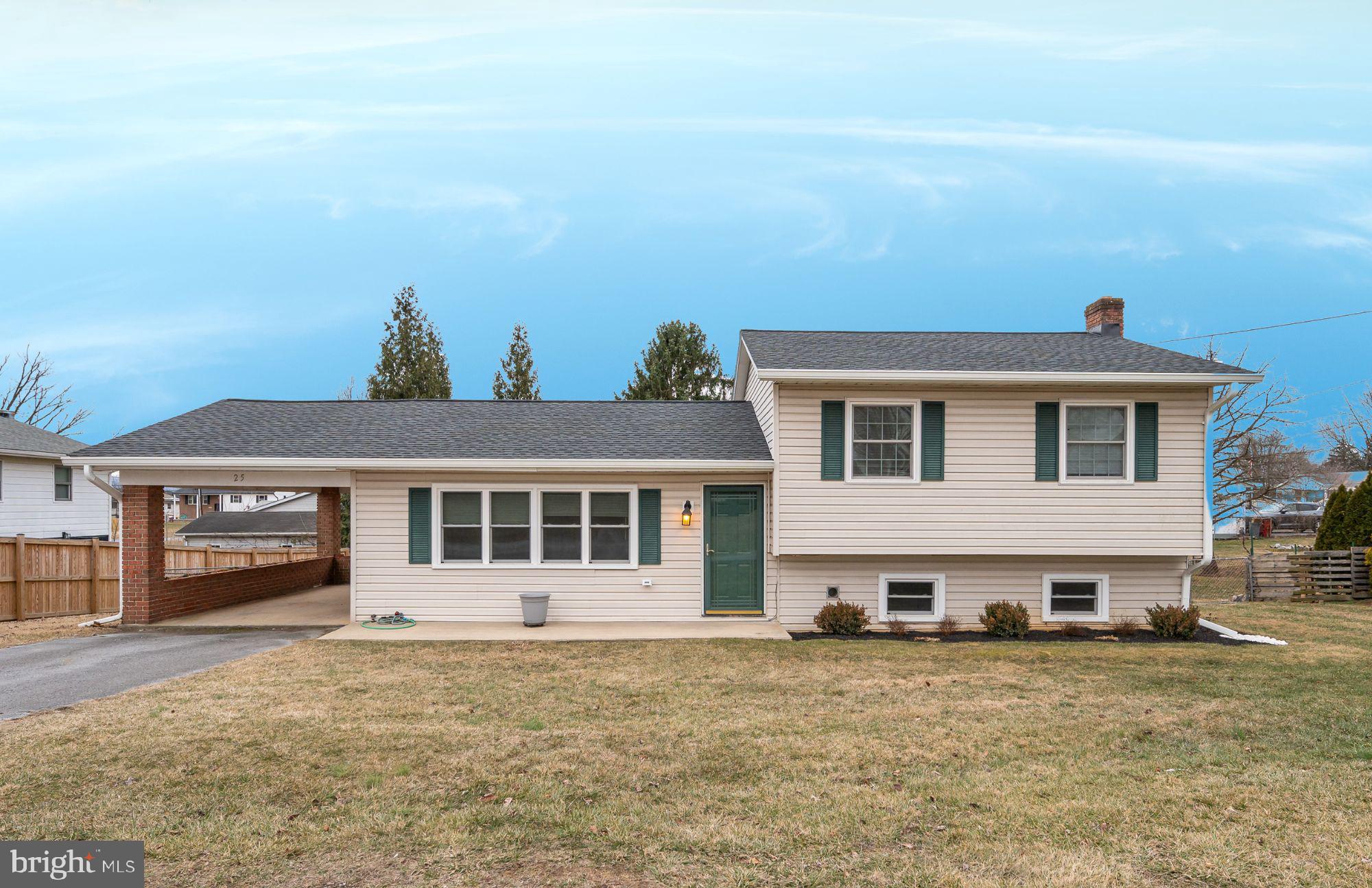 25 Stayman Drive Ranson, WV 25438 - Photo 1 of 34 a front view of a house with a garden