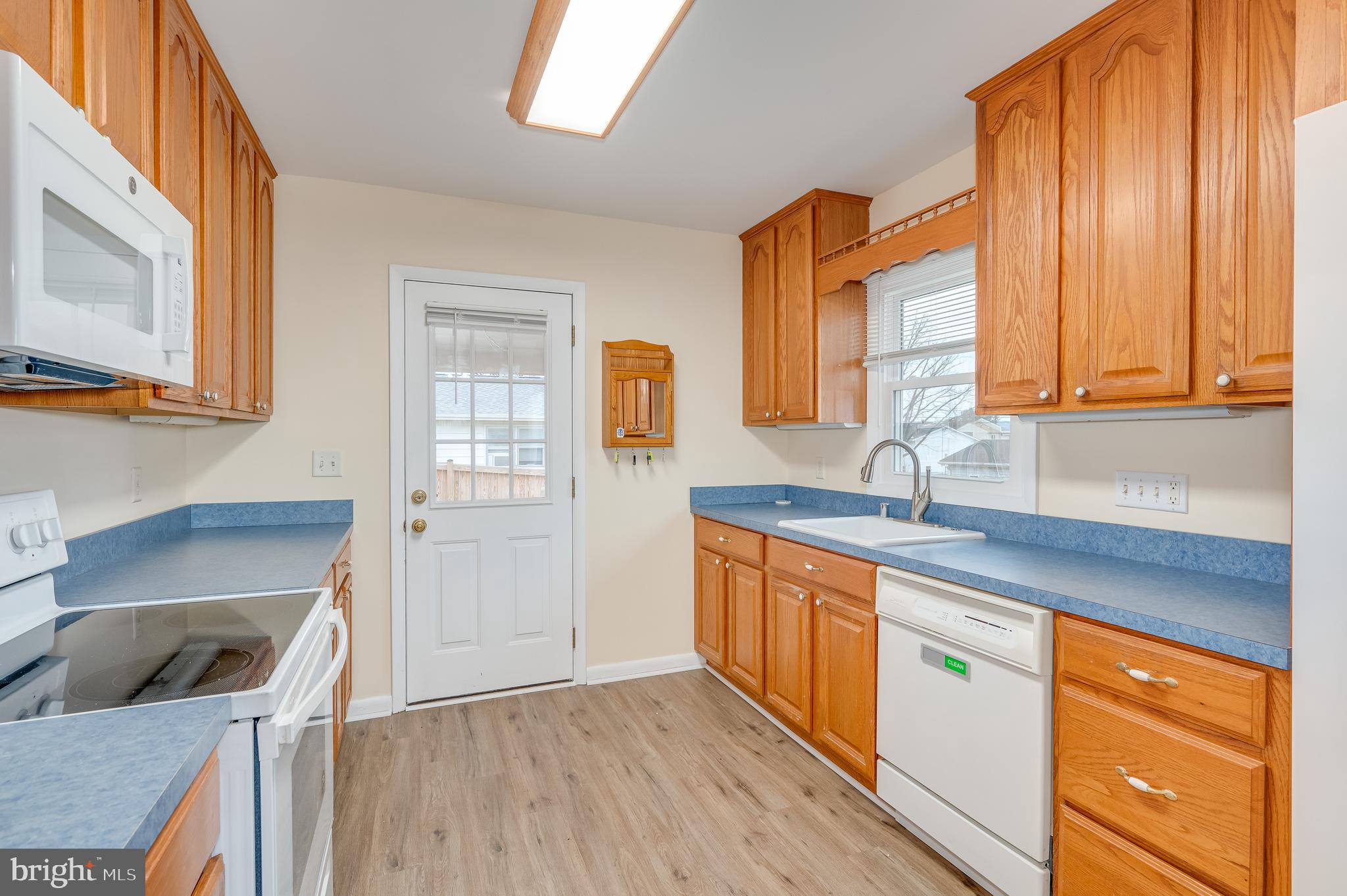25 Stayman Drive Ranson, WV 25438 - Photo 8 of 34 a kitchen with stainless steel appliances granite countertop a sink a stove and a refrigerator
