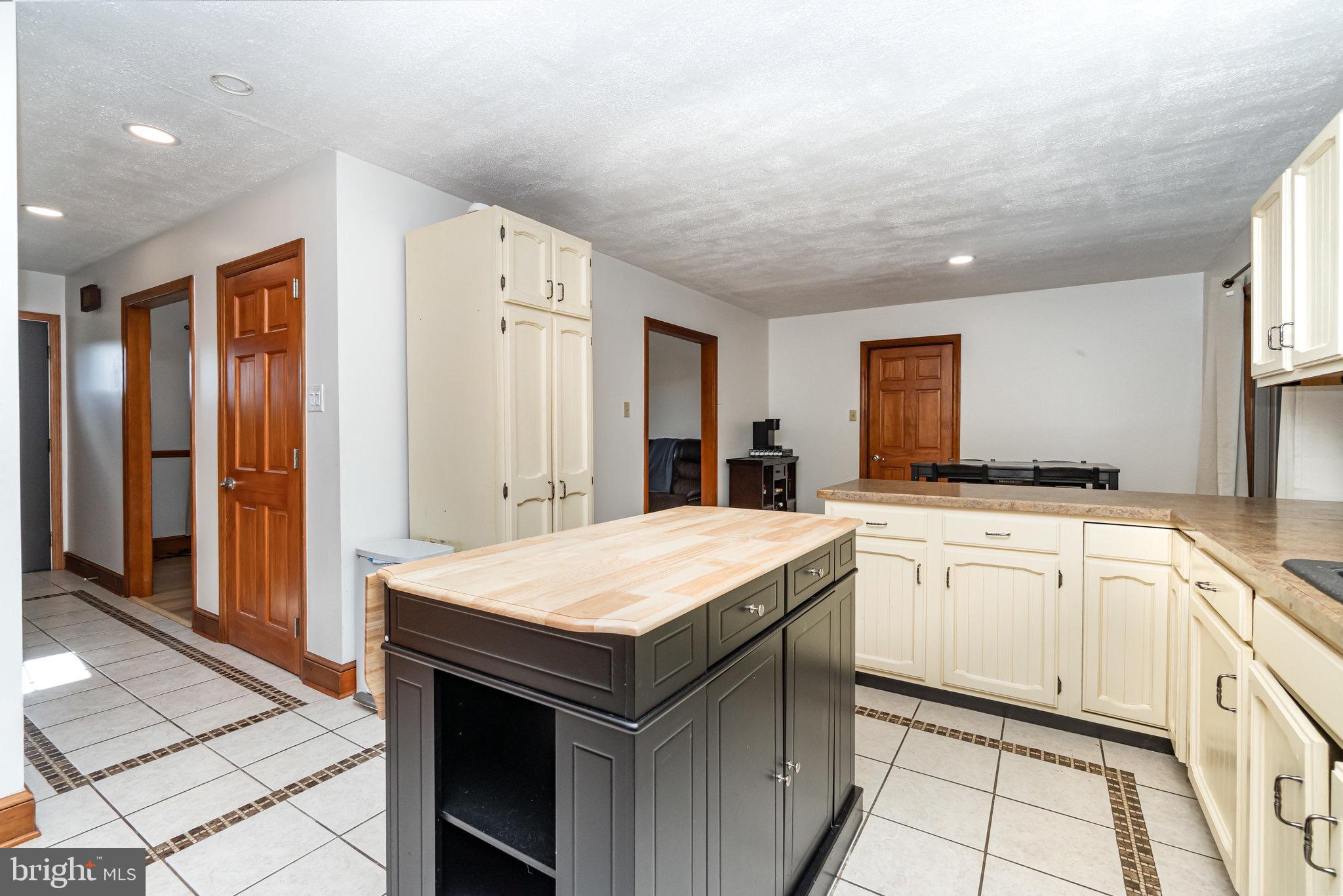 798 Byerland Church Road Willow Street, PA 17584 - Photo 15 of 31 a kitchen with a stove a sink and a refrigerator