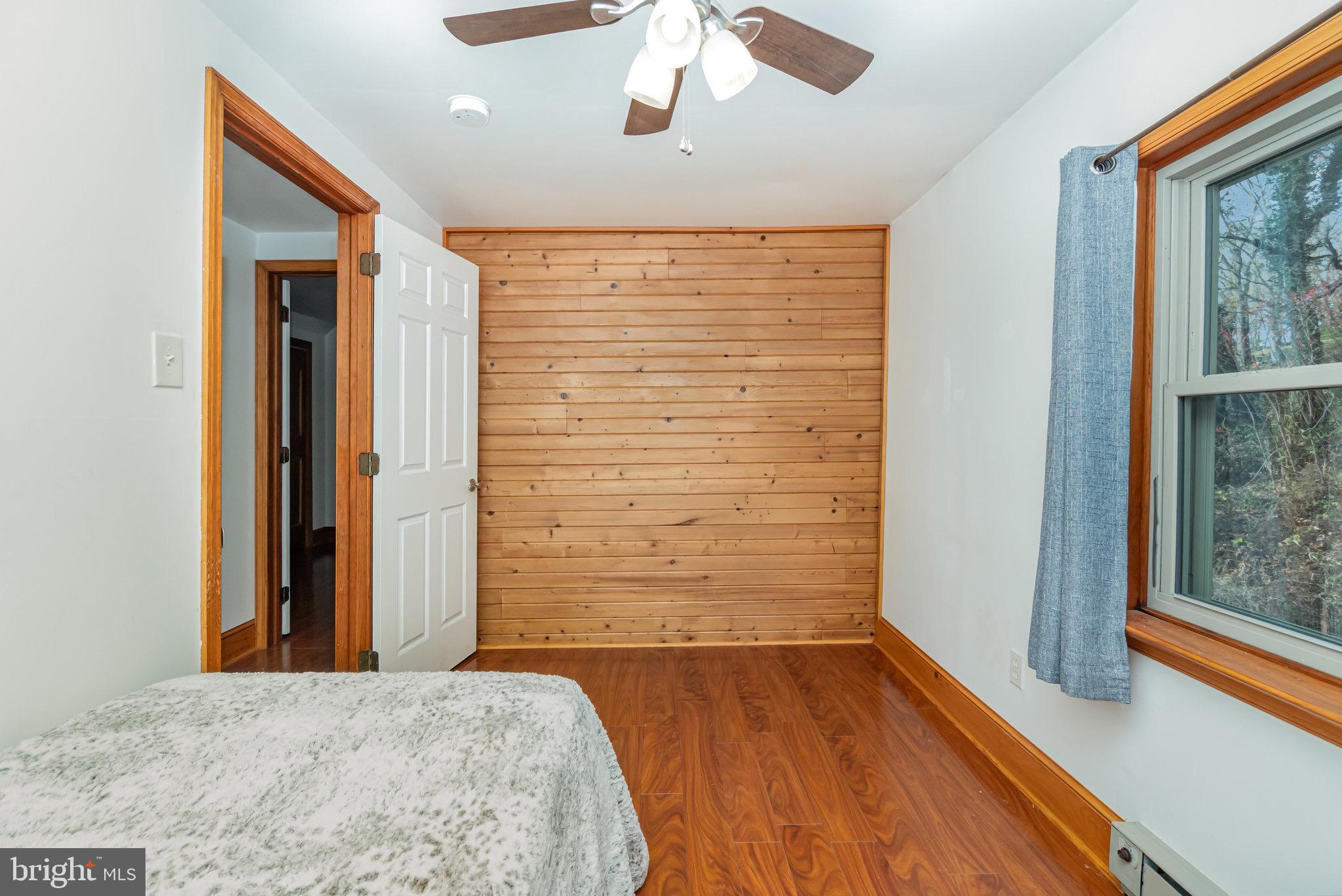 798 Byerland Church Road Willow Street, PA 17584 - Photo 23 of 31 wooden floor in an empty room with a window