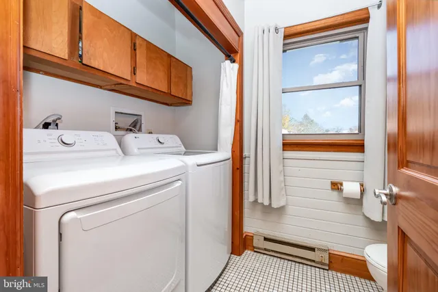a utility room with dryer and washer
