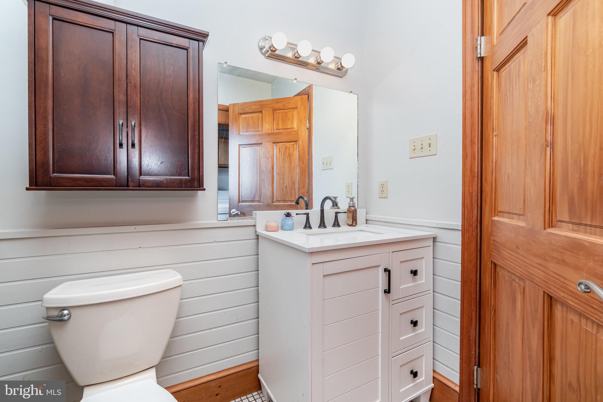 798 Byerland Church Road Willow Street, PA 17584 - Photo 25 of 31 a bathroom with a sink a toilet and mirror