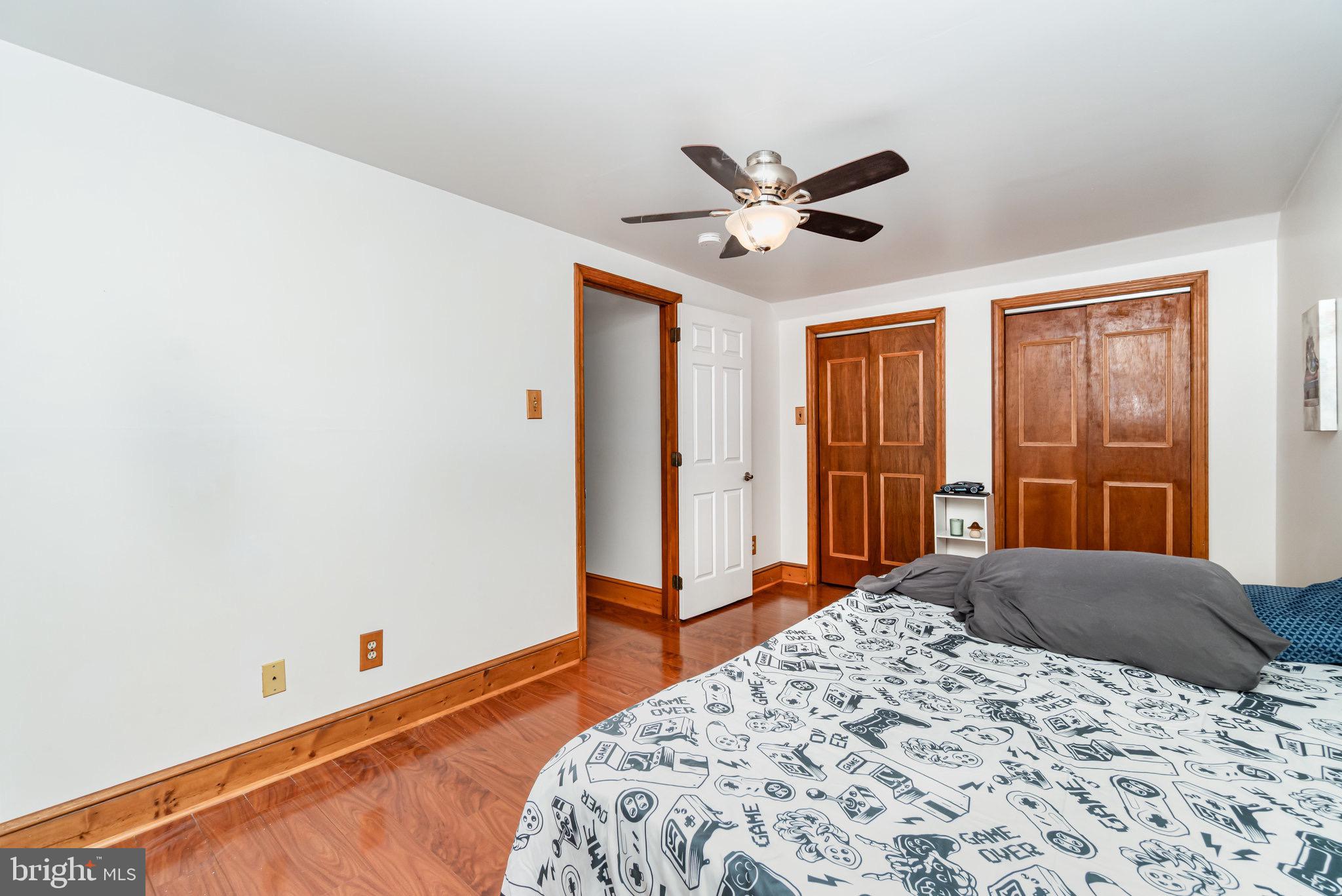 798 Byerland Church Road Willow Street, PA 17584 - Photo 27 of 31 a bedroom with a large bed and a chandelier