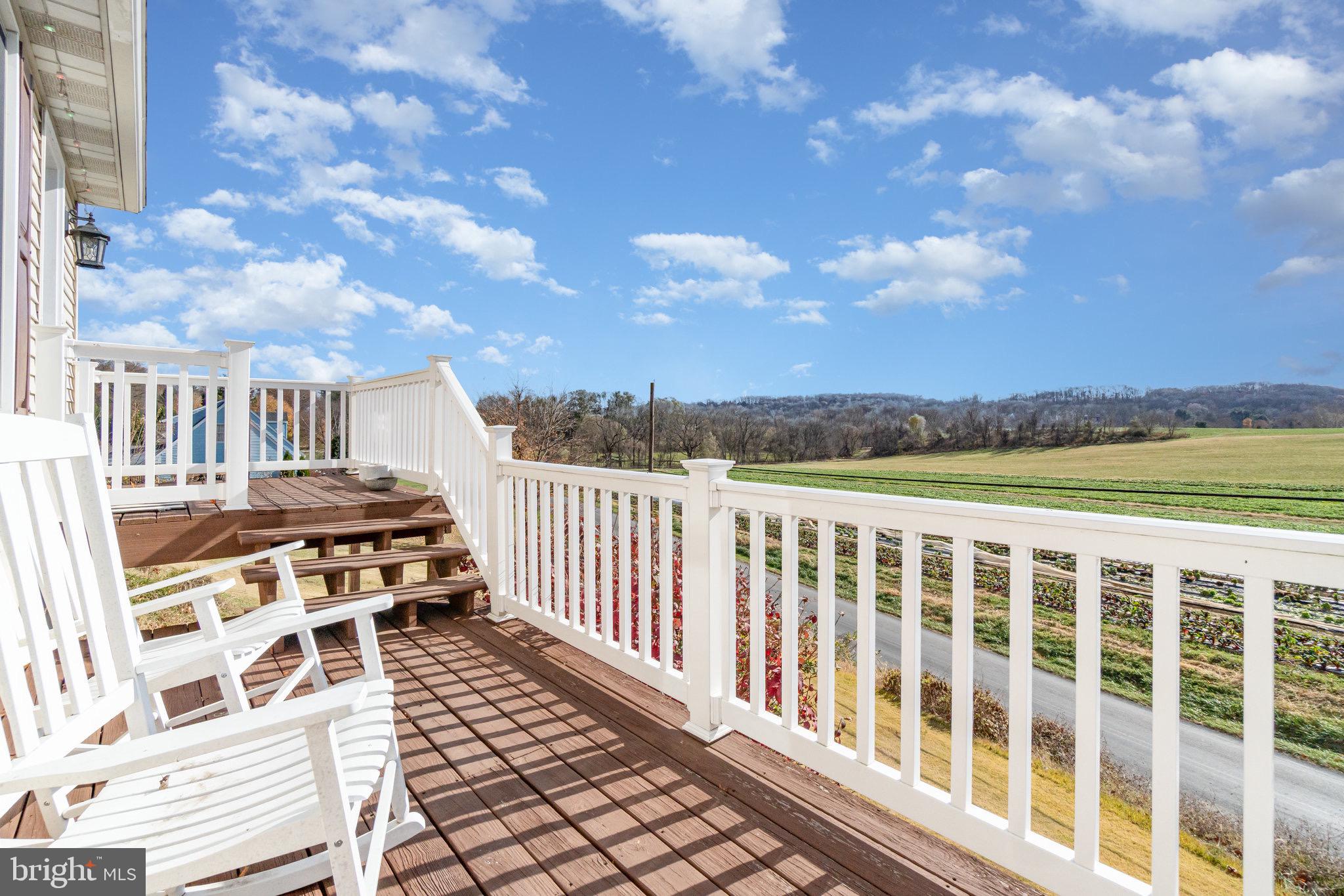 798 Byerland Church Road Willow Street, PA 17584 - Photo 4 of 31 a view of a balcony with wooden floor and city view