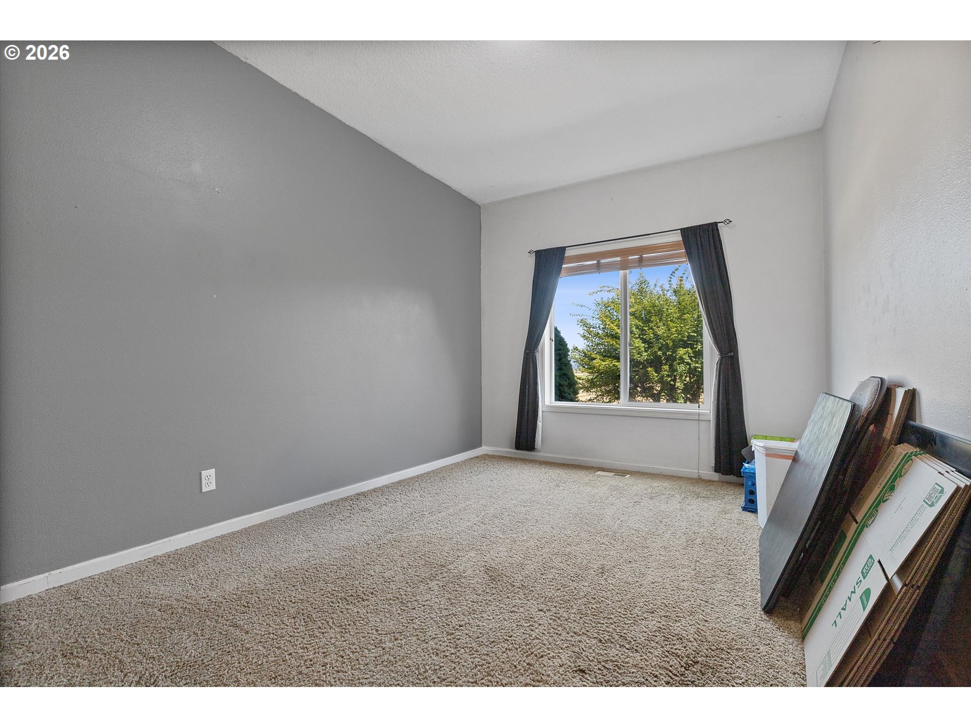 23455 Northeast Spring Hill Road Gaston, OR 97119 - Photo 20 of 48 a view of an empty room with wooden floor and a window