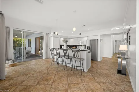 a living room with furniture and a lamp