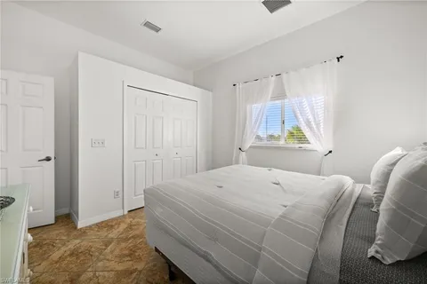 a view of a lake with couches in front of house