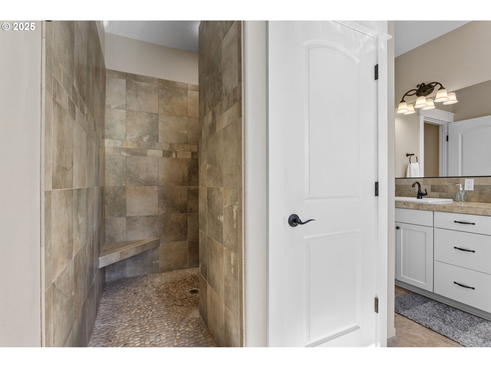 11660 Northwest Plainview Road Portland, OR 97231 - Photo 24 of 47 a bathroom with a granite countertop sink a mirror and shower