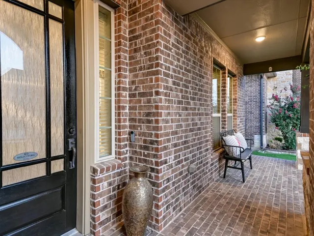 a view of a balcony with chairs