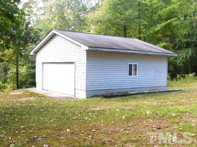 a view of a backyard with a cabin