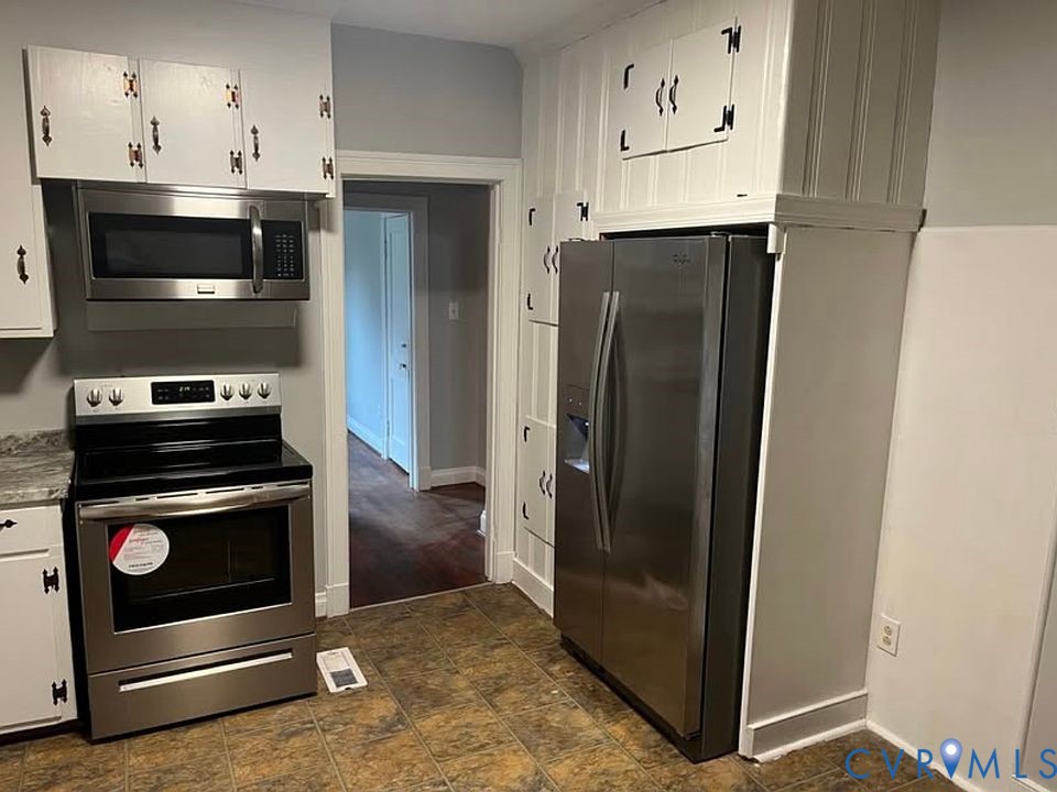 2005 Hungary Road Henrico, VA 23228 - Photo 3 of 5 a kitchen with stainless steel appliances a refrigerator a stove and cabinets