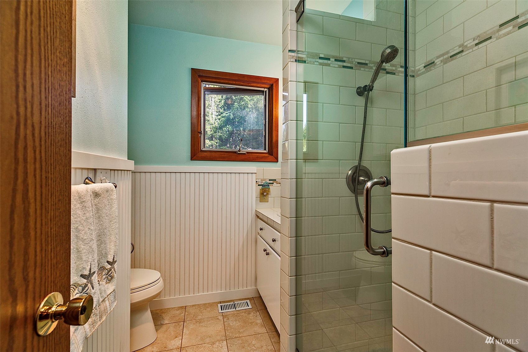 10518 Guthrie Road Anderson Island, WA 98303 - Photo 18 of 40 a bathroom with a toilet and a shower