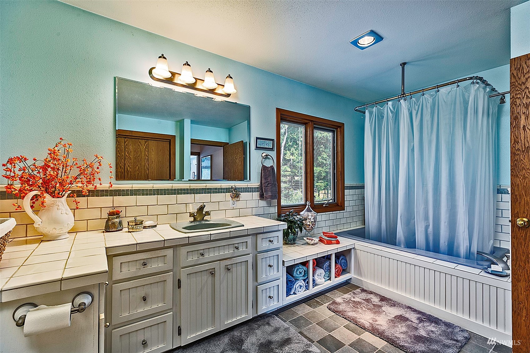 10518 Guthrie Road Anderson Island, WA 98303 - Photo 24 of 40 a bathroom with a double vanity sink mirror and double