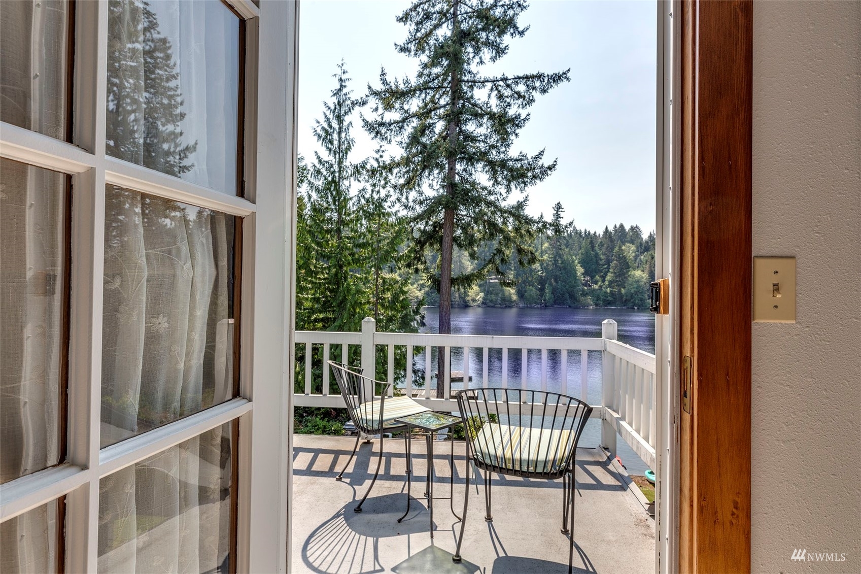 10518 Guthrie Road Anderson Island, WA 98303 - Photo 27 of 40 a view of a chair in wooden deck