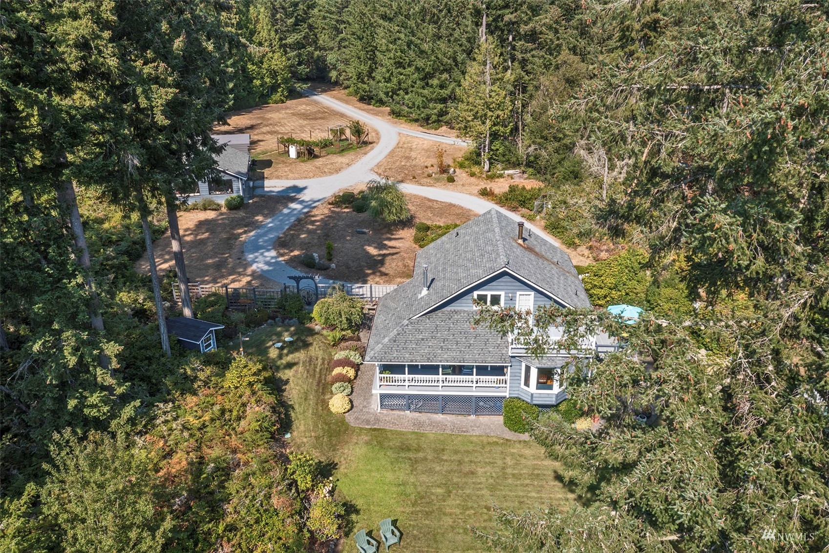 10518 Guthrie Road Anderson Island, WA 98303 - Photo 3 of 40 a view of a house with a yard